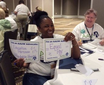 AAUW Greensboro members with advocate signs