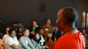 AAUW SVP Gloria Blackwell speaking to a crowd.