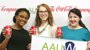three participants from the AAUW empower event holding cans of coca-cola, an AAUW partner