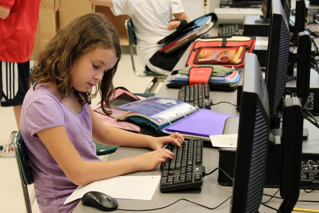 Middle school girl in computer class