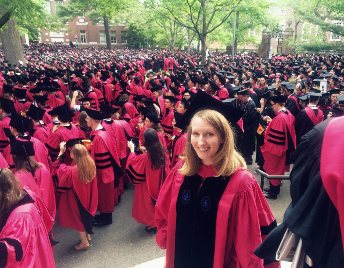 2014-15 American Fellow Hillery Metz at standing before a crowd at graduation