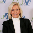 Photo of Lily Ledbetter in front of AAUW logo backdrop