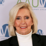 Photo of Lily Ledbetter in front of AAUW logo backdrop