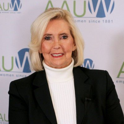 Photo of Lily Ledbetter in front of AAUW logo backdrop