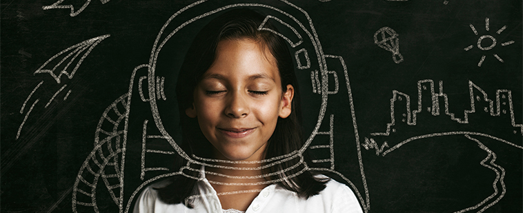 Young girl with eyes closed dreaming of being an astronaut