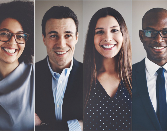 Smiling group of ethnically diverse businessmen and businesswomen