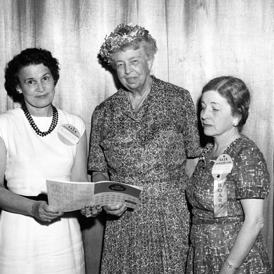Black and white photo of Eleanor Roosevelt at the AAUW National Convention in June 1959 with two AAUW members.