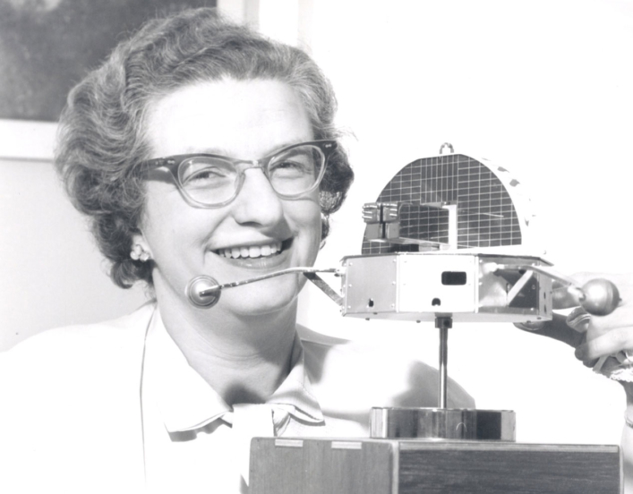 Nancy Grace Roman with a model of the Orbiting Solar Observatory in 1962.
