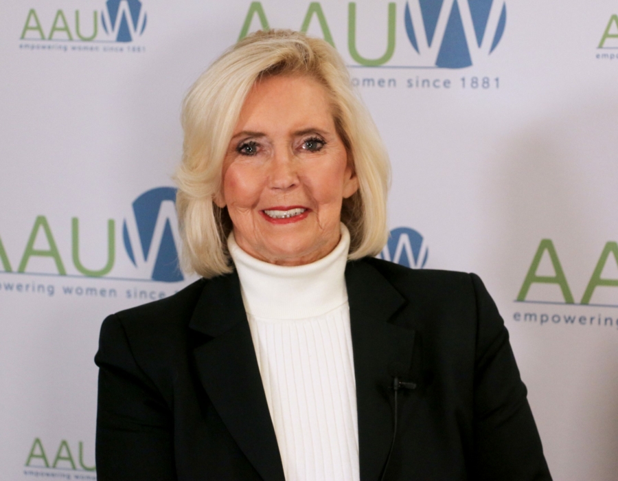 Photo of Lily Ledbetter in front of AAUW logo backdrop