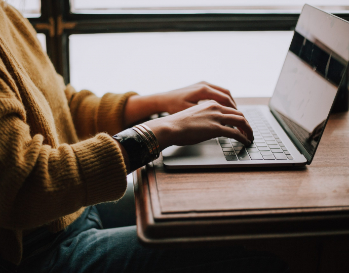 woman typing on a computer