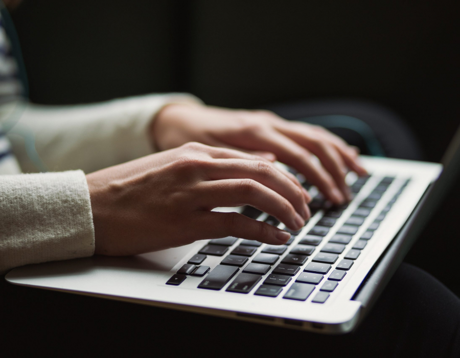 Person typing on a laptop