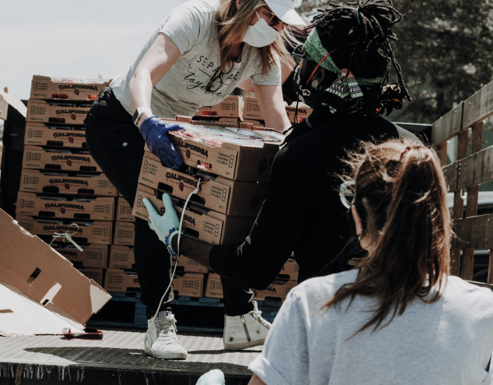 Two women doing volunteer work