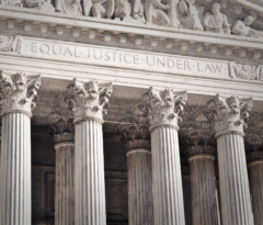 Close up photo of the front of the US Supreme Court building,