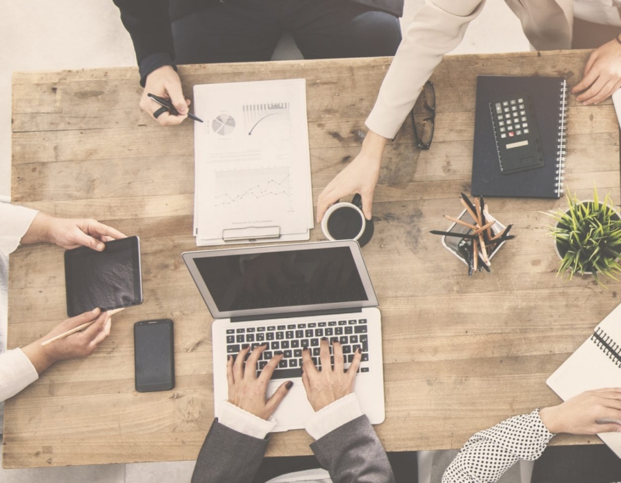 An overhead shot of people working in an office.