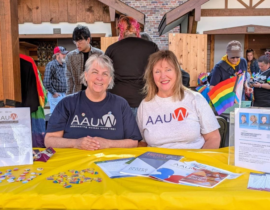 Two AAUW volunteers tabling for the cause.