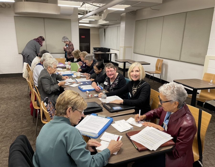 Members working together at a table.